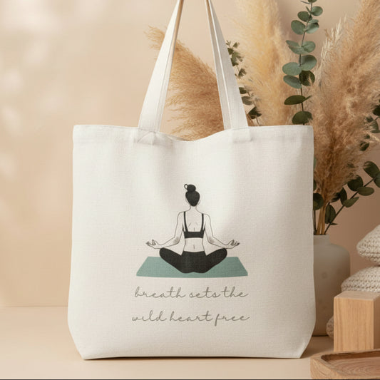 Tote bag with a yoga-themed design and text on a light surface.