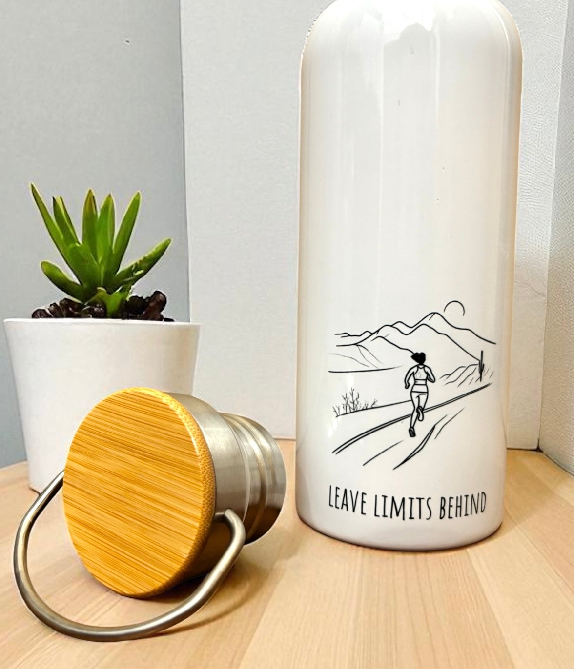 Leave Limits Behind Metal Water Bottle – 500ml Stainless Steel Insulated Flask with Line Art Female Runner Design