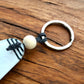 Leave Limits Behind Keyring – Retro Motel Style Boho Keychain with Female Runner Line Art Design Through Nature, Gift for Runners & Outdoor Lovers