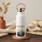 White water bottle with 'Adventure is My Compass' design on a wooden surface with decorative elements.