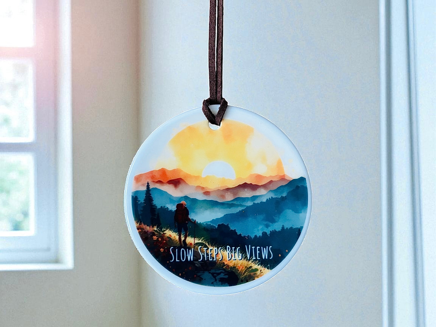 Slow Steps Big Views Ceramic Hanging Ornament – Hiker in Mountains at Sunset | Boho Adventure Home Décor