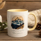Mug with mountain design and 'nature sets the pace' text on a white surface.