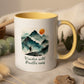 Mug with mountain design and text 'Wander wild, Breathe easy' on a plain background